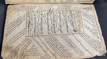Image of Manuscript of religious commentary. In this image, al-Taftāzānī’s sharḥ (commentary) on al-Nasafī’s al-ʿAqāʾid al-Nasafīyya (the creed of an-Nasafī) can be seen within the textblock. In the marginalia and between the text, glosses on this commentary and intertextual references by several different scholars can be found.