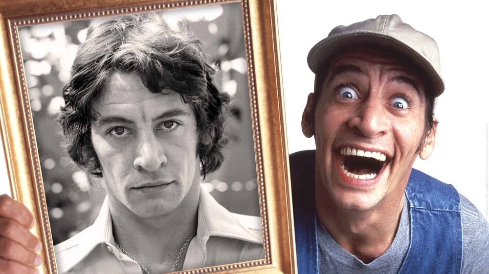  Jim Varney, as the beloved character Ernest P. Worrell, holds a portrait of himself.