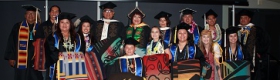 Graduates wearing caps and gowns at the 2-18 American Indian Studies graduation ceremony at UCLA.