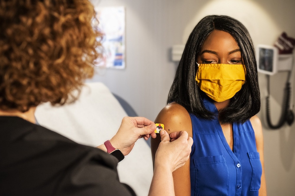 Woman receives vaccine shot