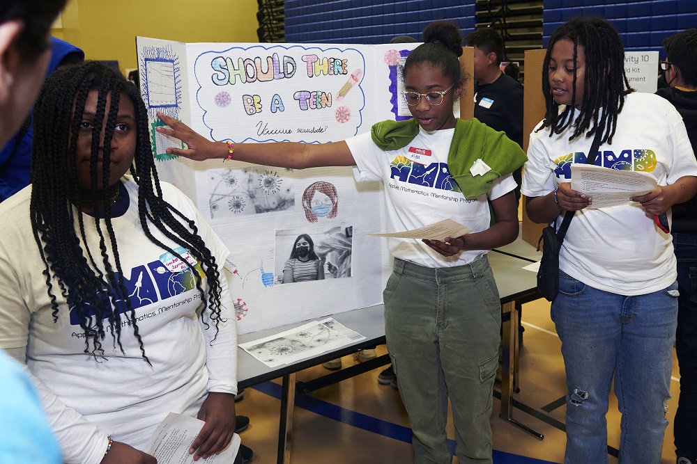 Middle school students presenting about STEM research in their South L.A. communities