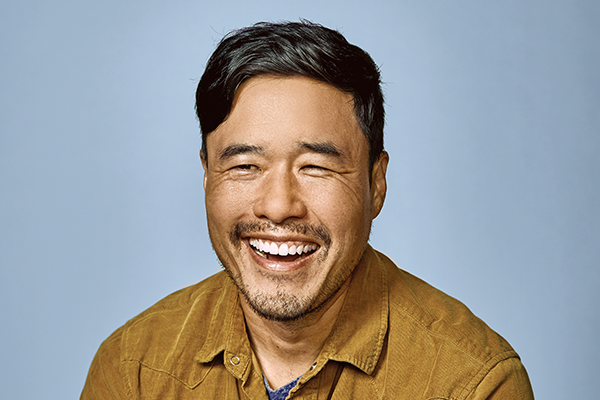 Head and shoulders photo of Randall Park against a blue background.