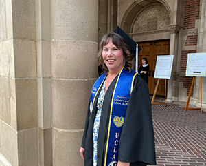 Kingman_363 Kelly Kingman in graduation regalia outside of Royce Hall