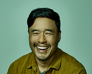 Park-Randall_363 Head and shoulders photo of Randall Park against a green background.