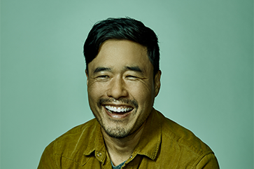 Head and shoulders photo of Randall Park against a green background.