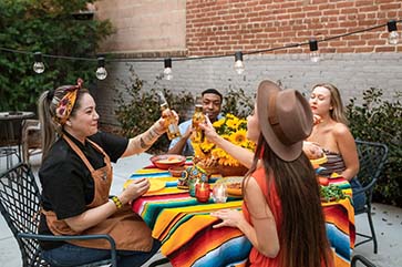 Multiracial group of young people eating at a table