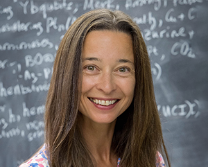 Anastassia Alexandrova in front of chalkboard