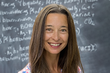 Anastassia Alexandrova in front of chalkboard