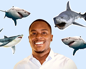 Head and shoulders photo of De'Marcus Robinson smiling against a light blue background with cut-out images of sharks surrounding him.