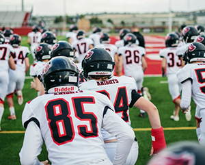 Football team running onto the field