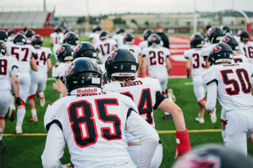 Football team running onto the field