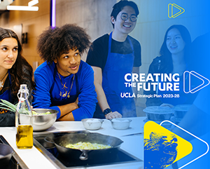 Four students in blue aprons stand in front of bowls and food on stove