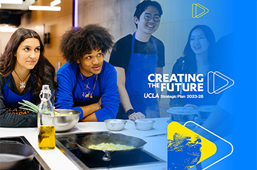 Four students in blue aprons stand in front of bowls and food on stove