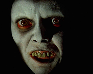 close-up image of a scary figure with pale skin