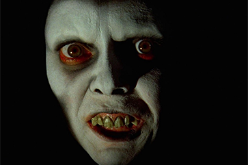 close-up image of a scary figure with pale skin