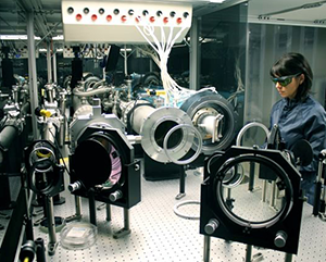 Carmen Constantin stands near Phoenix laser components