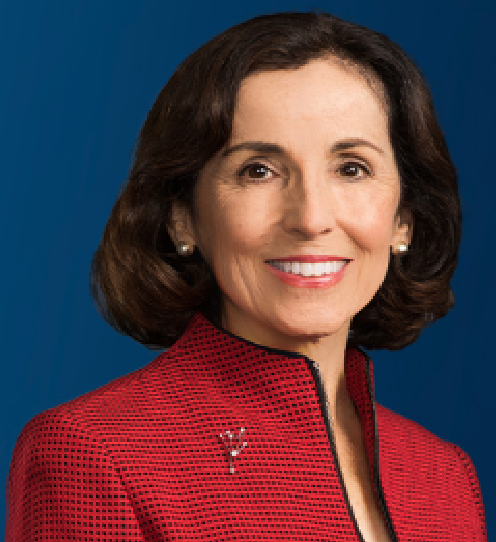 A head and shoulders photograph of France A. Córdova in a red coat against a blue background.