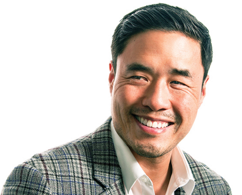 A head and shoulders photograph of Randall Park in a suit, smiling against a white background.