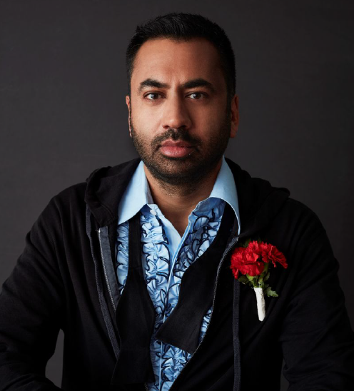 A head and shoulders photograph of Kal Penn against a dark grey background.