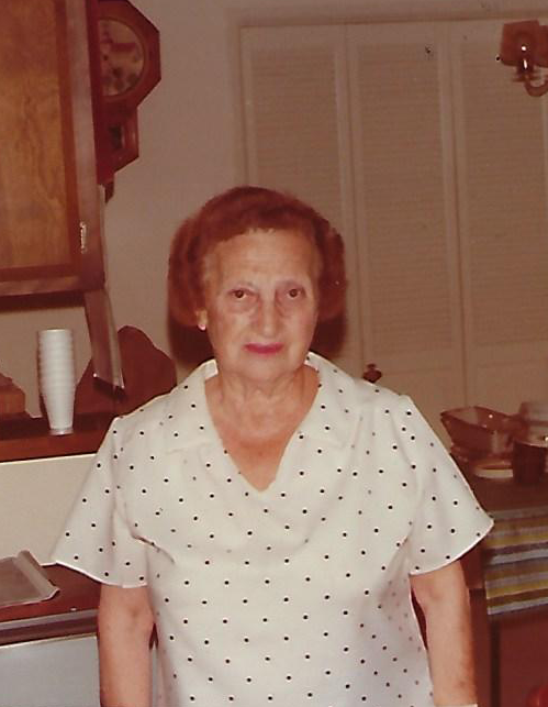 A photo of Annette Blumner in a white shirt with black polka dots.