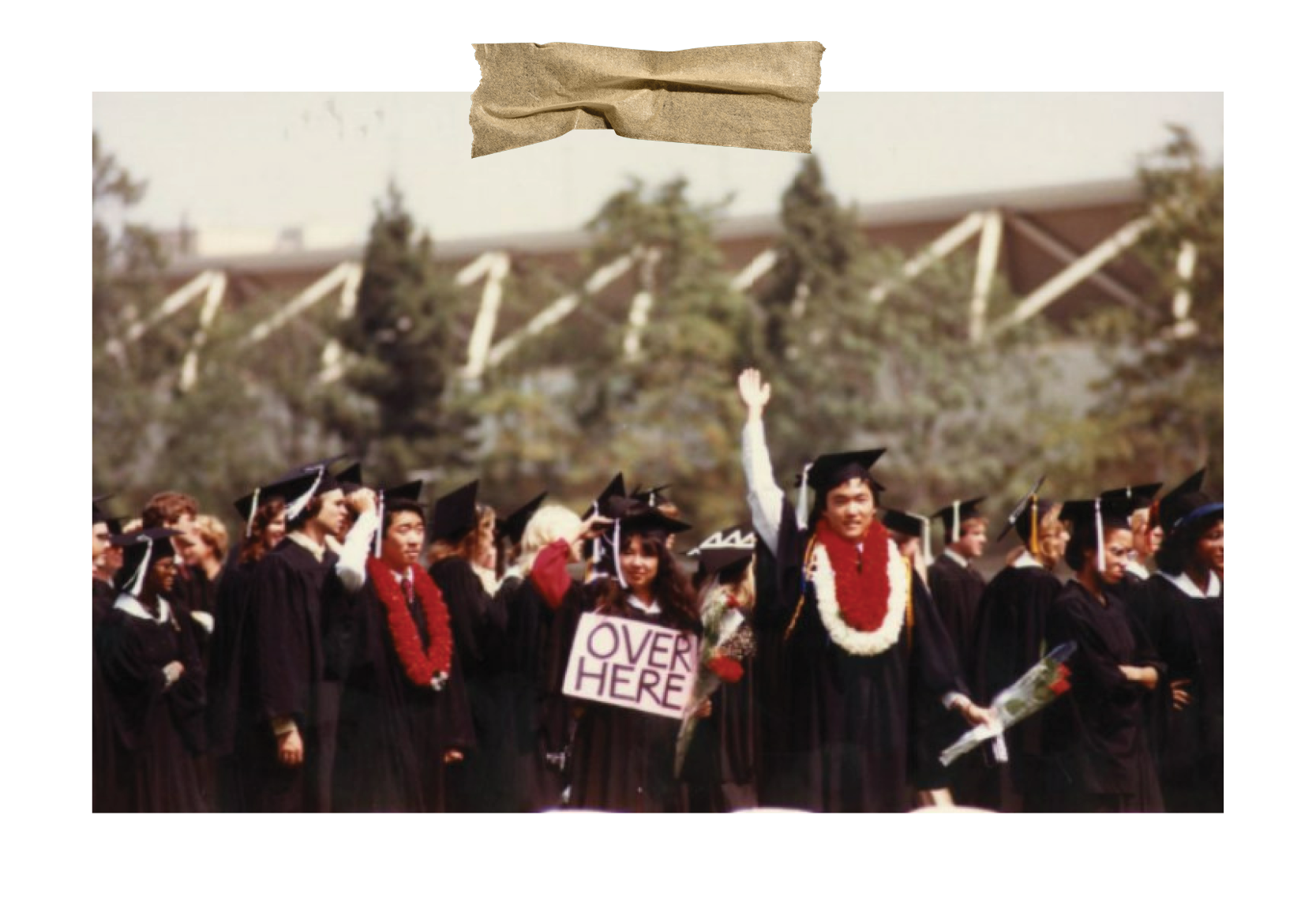 A color photograph from the early 1980s of students in graduation regalia outside on a sunny day.