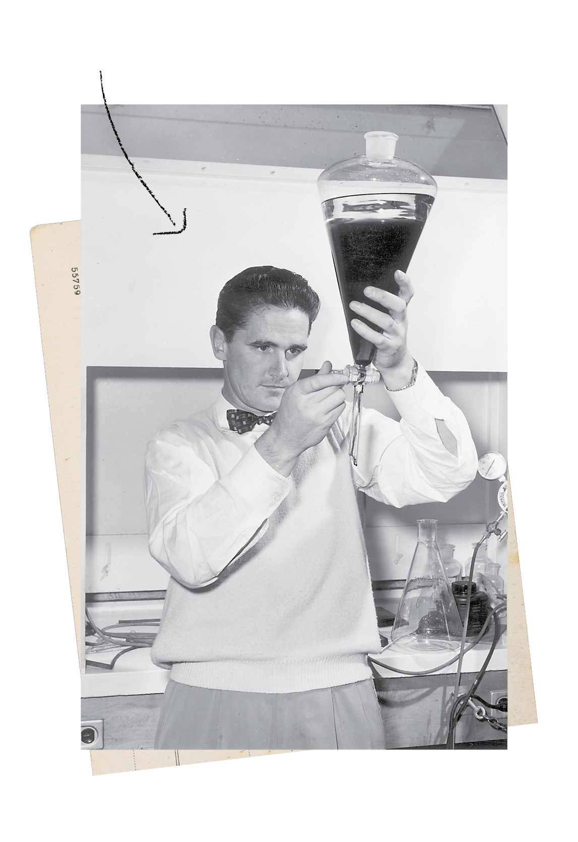 A black and white photograph of Biochemist Donald J. Cram wearing a bow tie as he works with equipment in a lab.