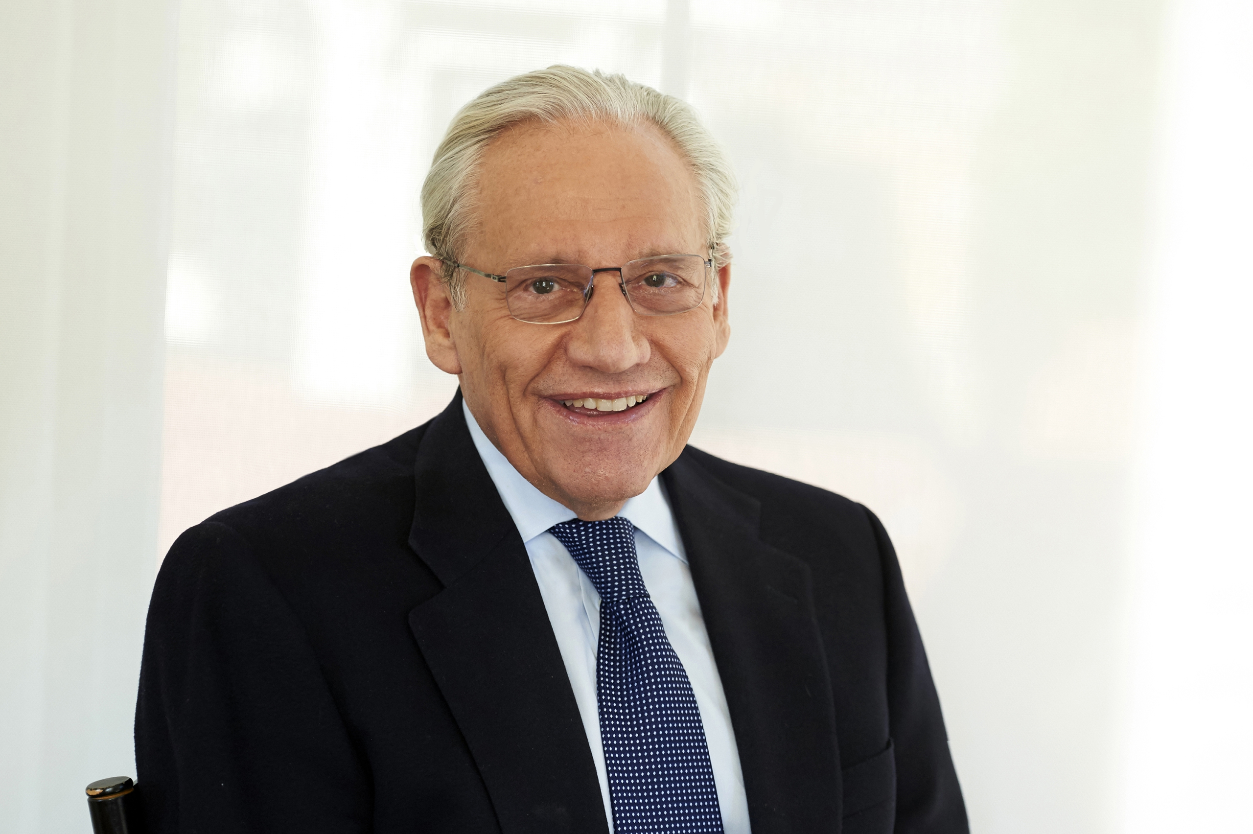 A head and shoulders photograph of Bob Woodward in a suit and tie.