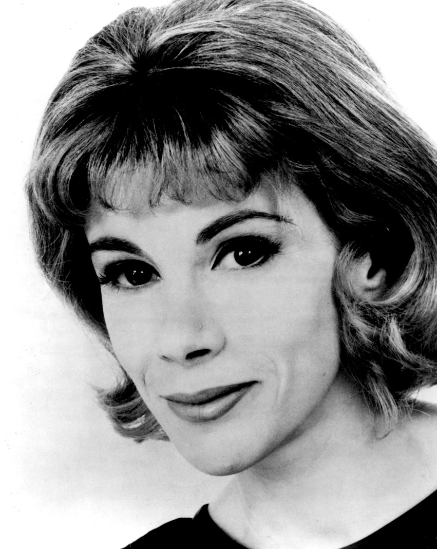 A black and white photograph of Joan Rivers.