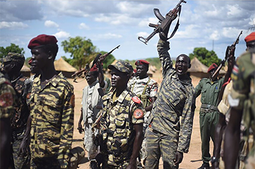 Soldiers in Sudan, some holding rifles up in the air