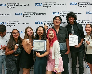 An image of Ashe Scholar Sydney Do (fourth from left) honored at a UCLA Academic Advancement Program award reception in October, surrounded by her friends from the AAP’s Transfer Summer Program.