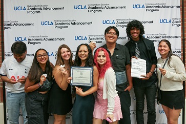 An image of Ashe Scholar Sydney Do (fourth from left) honored at a UCLA Academic Advancement Program award reception in October, surrounded by her friends from the AAP’s Transfer Summer Program.