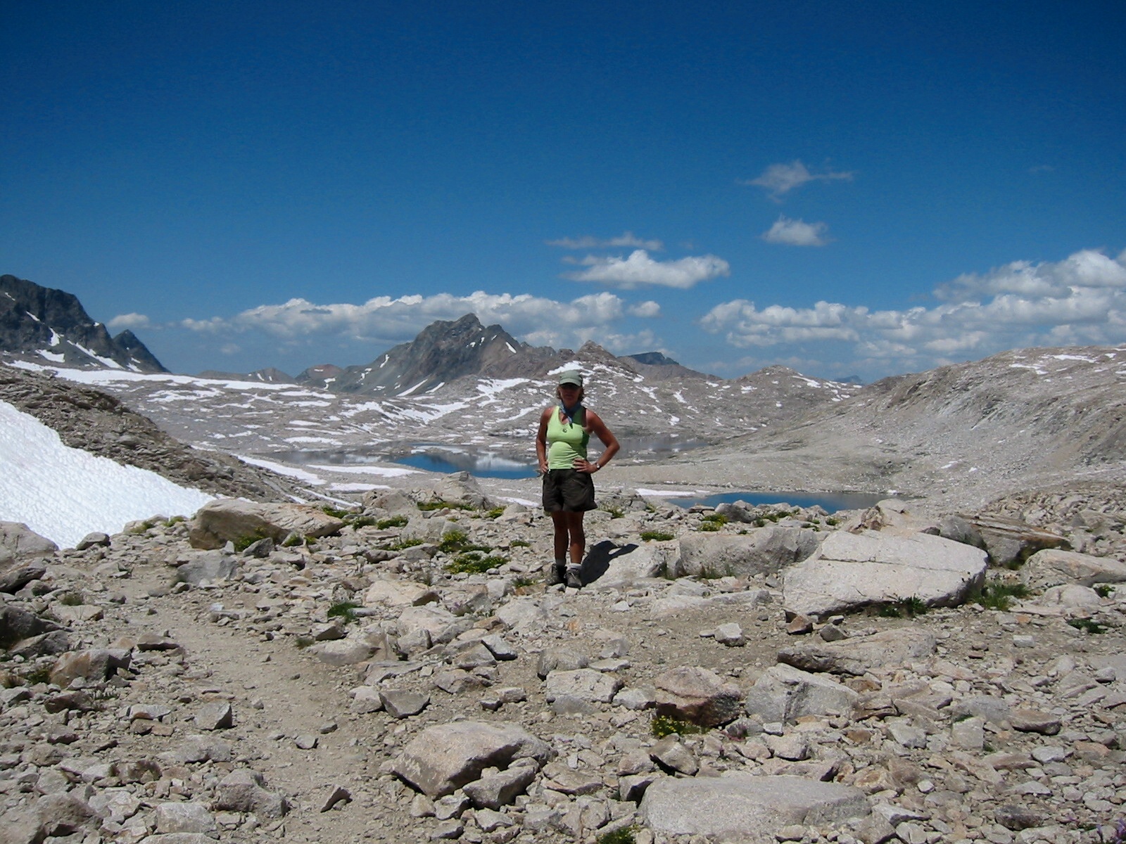 Joan Griffin standing on top of Muir Pass.