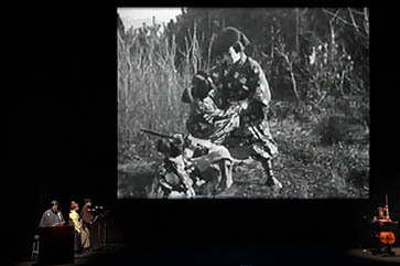 Benshi performers with film