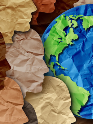Photo of a paper collage of various faces in profile and the Earth