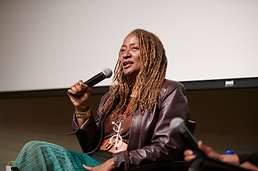 L.A. County Supervisor Holly J. Mitchell holding a microphone