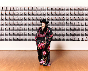 Erika Hirugami standing in front of exhibit