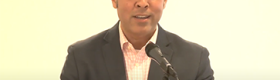 Jason De Leon speaking from a podium with a microphone in front of him.