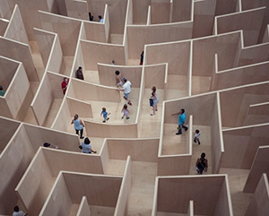 People walk through maze