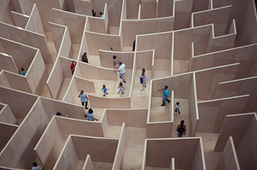 People walk through maze