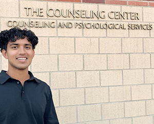 Anish Dulla-363-241 Anish posing in front of UCLA's Counseling and Psychological Services office