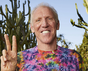 Bill+Walton+Hero-363-241 Bill Walton in a floral tie-dye shirt in an outdoor setting.