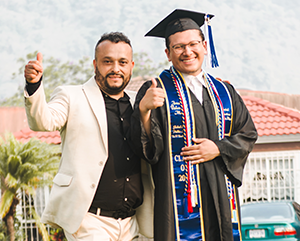Jonathan-Valenzuela-Mejia-363-241 Jonathan Valenzuela Mejia, right, and father giving a thumbs-up