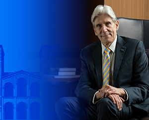 NewsroomStory_363-241 UCLA Chancellor-designate Dr. Julio Frenk seated in front of Royce Hall with partial blue tinted treatment