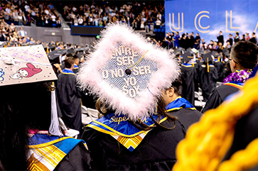 Graduates attending a UCLA College Commencement ceremony at Pauley Pavillion.