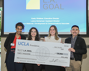 Philanthropy+As+Civic+Engagement+Ceremony-363-241 Four people hold up big check made out to L.A. Goal