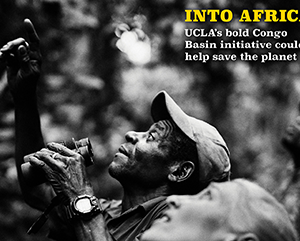 UCLA-mag-summer-24-363-241 A black and white photograph of two people looking up while one holds binoculars. On the right-hand side the words "INTO AFRICA: UCLA's bold Congo Basin Institute could help save the planet."