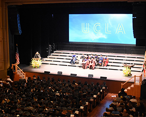 commencement-Royce-Hall-UCLA-Humanities-363-241 View from balcony of Royce Hall audience and stage during 2024 Humanities commencement ceremony.