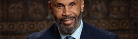 horizontal head-and-shoulders portrait of Darnell Hunt in suit and tie