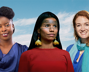 PEEGA-363-241 A Adenike Oladosu, Nina Gualinga, Callie Veelenturf against a blue sky with clouds