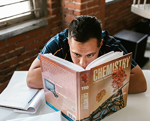 chemistry-363-241 Student reading a chemistry textbook